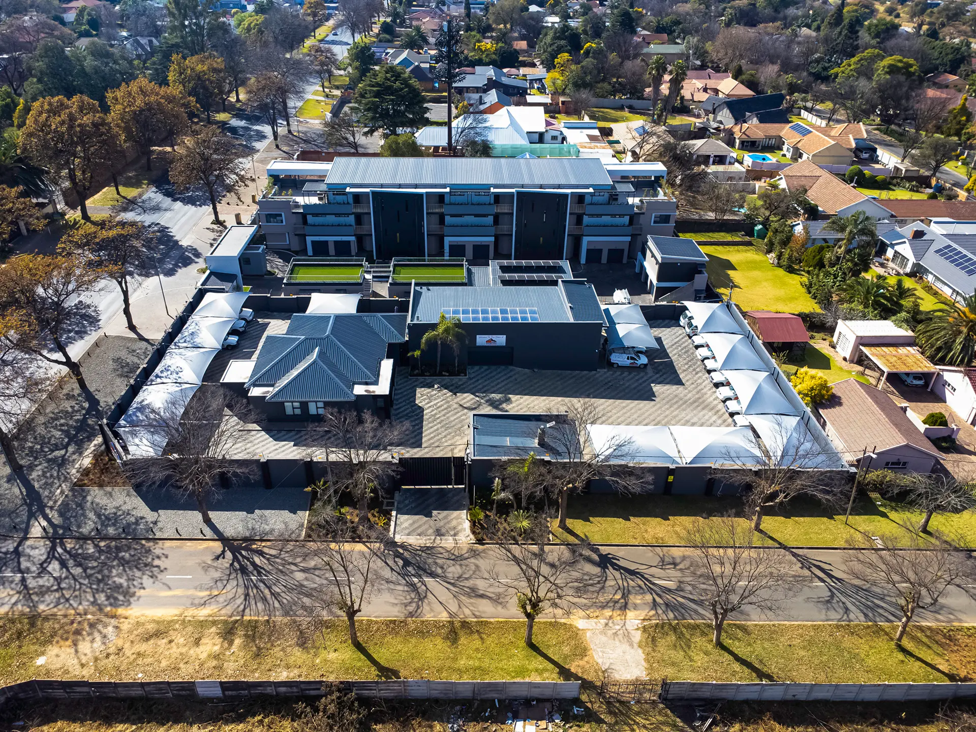 Certified Sicon Group roof inspectors completing an aerial assessment of a modern Gauteng property